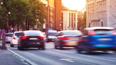 Cars driving down road